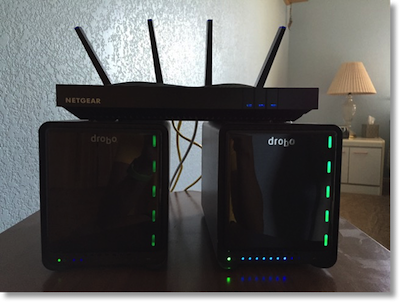 Netgear X8 sitting on top of two Drobos