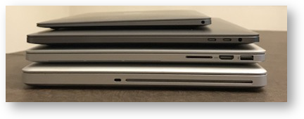 Four macbooks side view