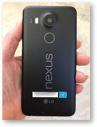 Nexus 5x in my hand showing fingerprint and camera