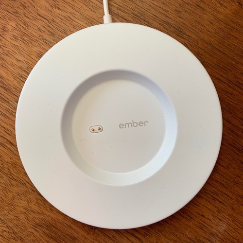 Ember mug coaster showing pins