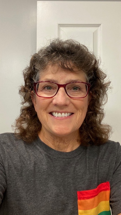 #title# Allison wearing red Zenni glasses in gay pride shirt