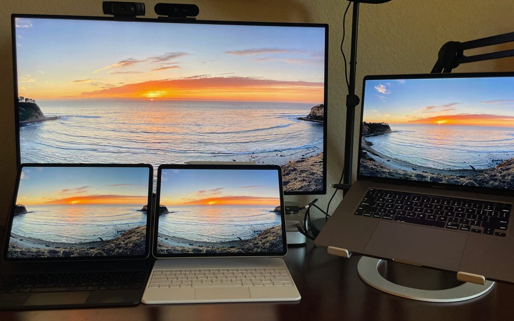 #title# 2021 iPad Pro running XDR display flanked by 2018 iPad Pro and 16inche MacBook Pro