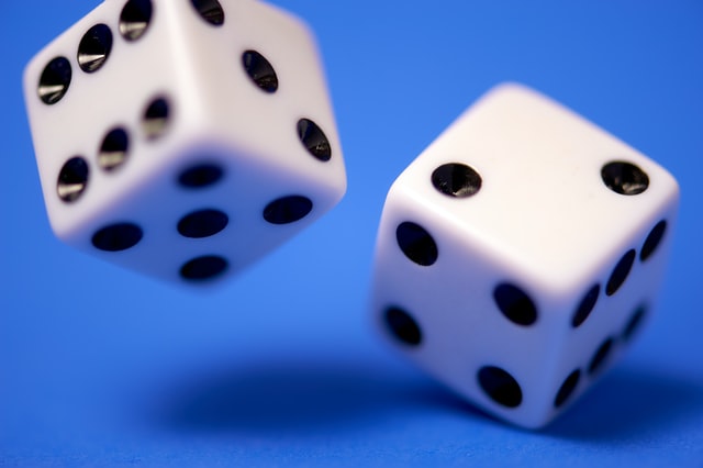 Photo of rolling dice by Edge2Edge Media on Unsplash