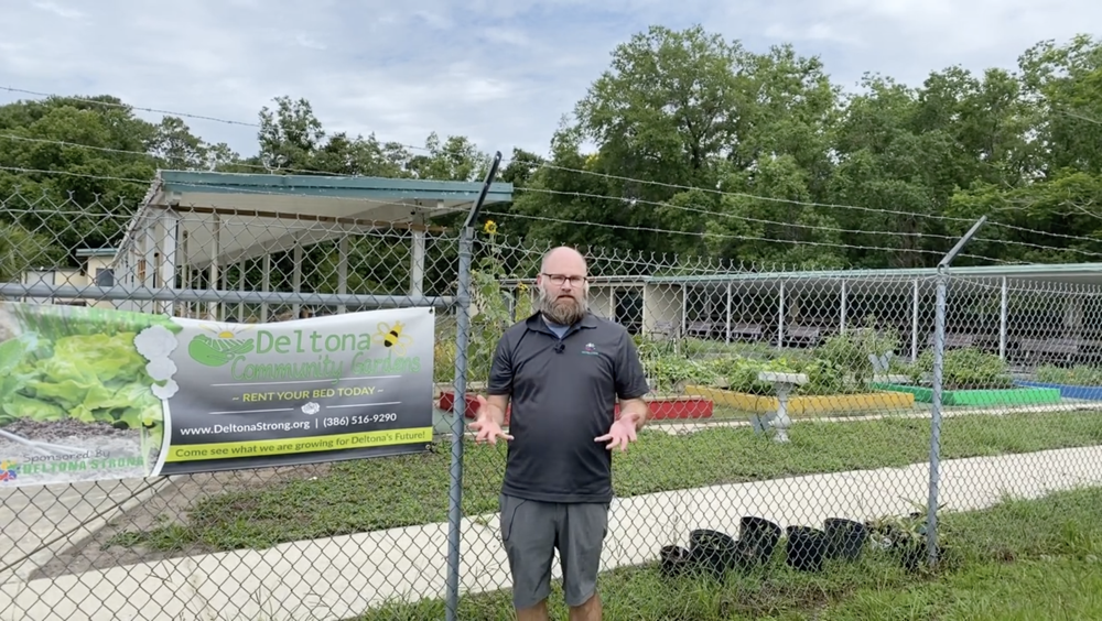 Troy Recording in Front of Community Garden