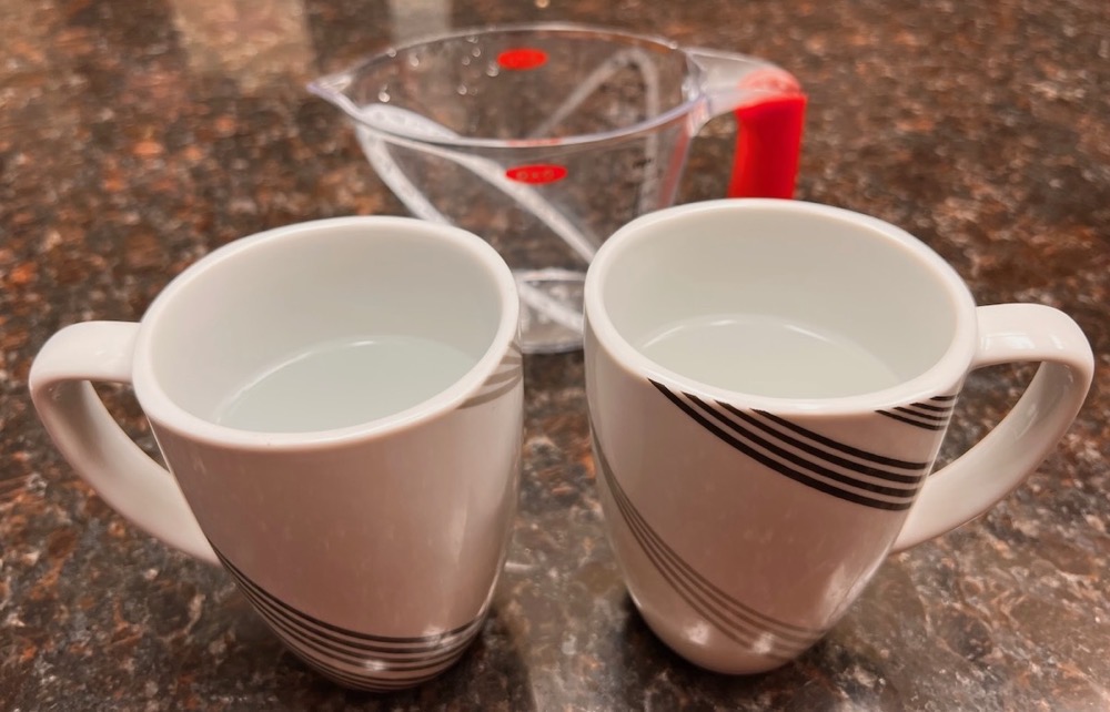 2 Mugs with 1 Cup Water Each ready to be tested in the experiment