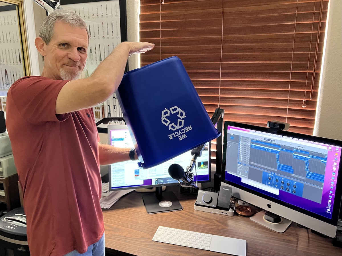 #title# Steve holding upside down recycling bin over the mic