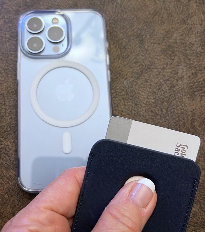 Blue Kimguard MagSafe Wallet Sliding Out Apple Card with MagSafe Clear case in background on iPhone 13 Pro