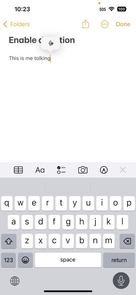Dictation on iOS 16 with tiny mic with an x on it to stop transcribing
