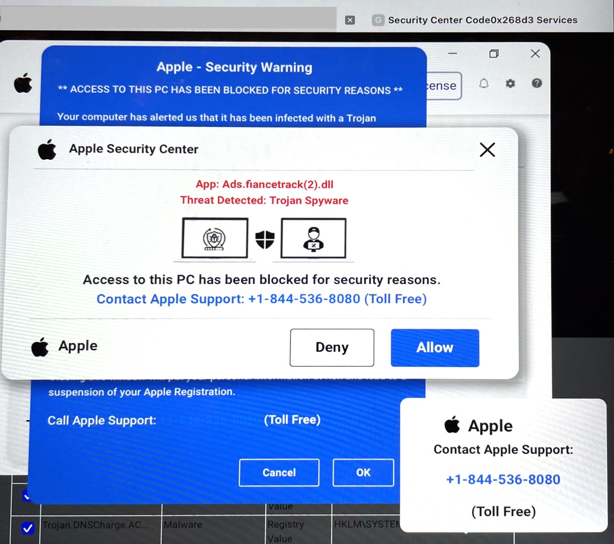 Page says Apple Security Center with a phone number. Has overlapping windows (first hint) and x's in the corner to close them and apple supposedly saying this 