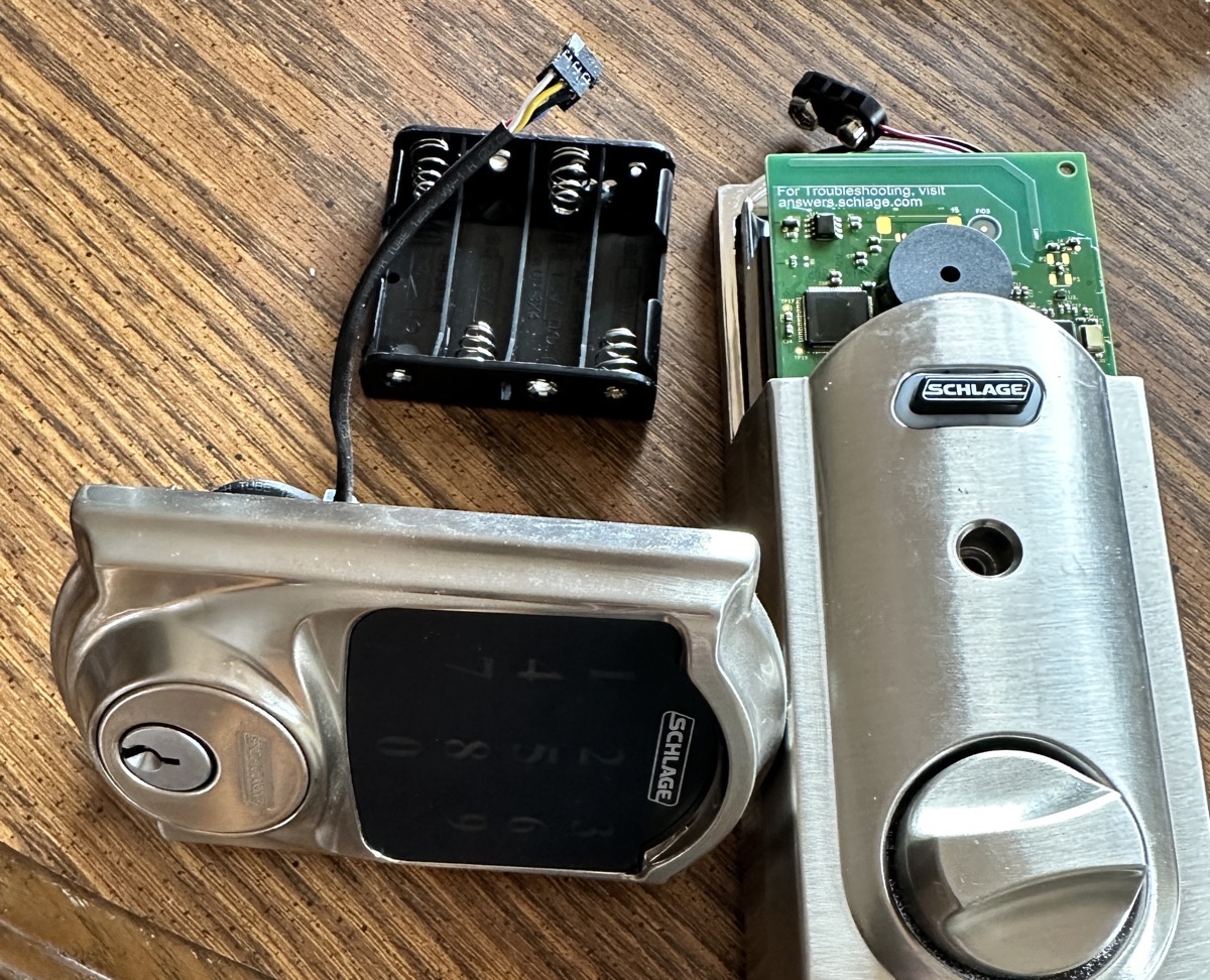 Old schlage lock disassembled on a desk