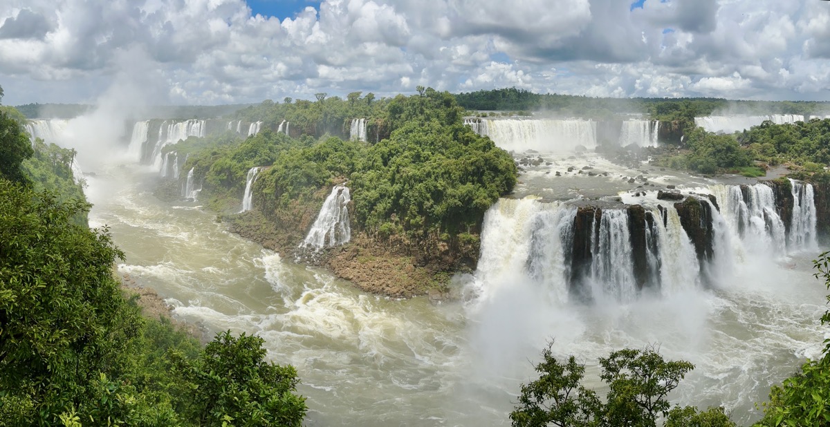 Iguazú Falls - very hard to describe the enormity - pano with layers of falls, blue skies and puffy clouds