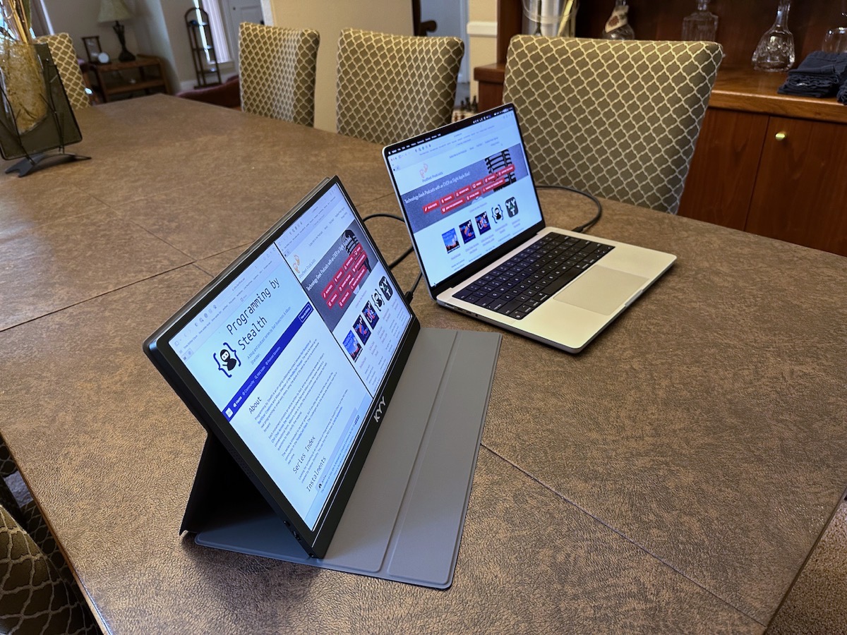 KYY display Beside MacBook Pro Showing Area Case Takes Up on a Desk