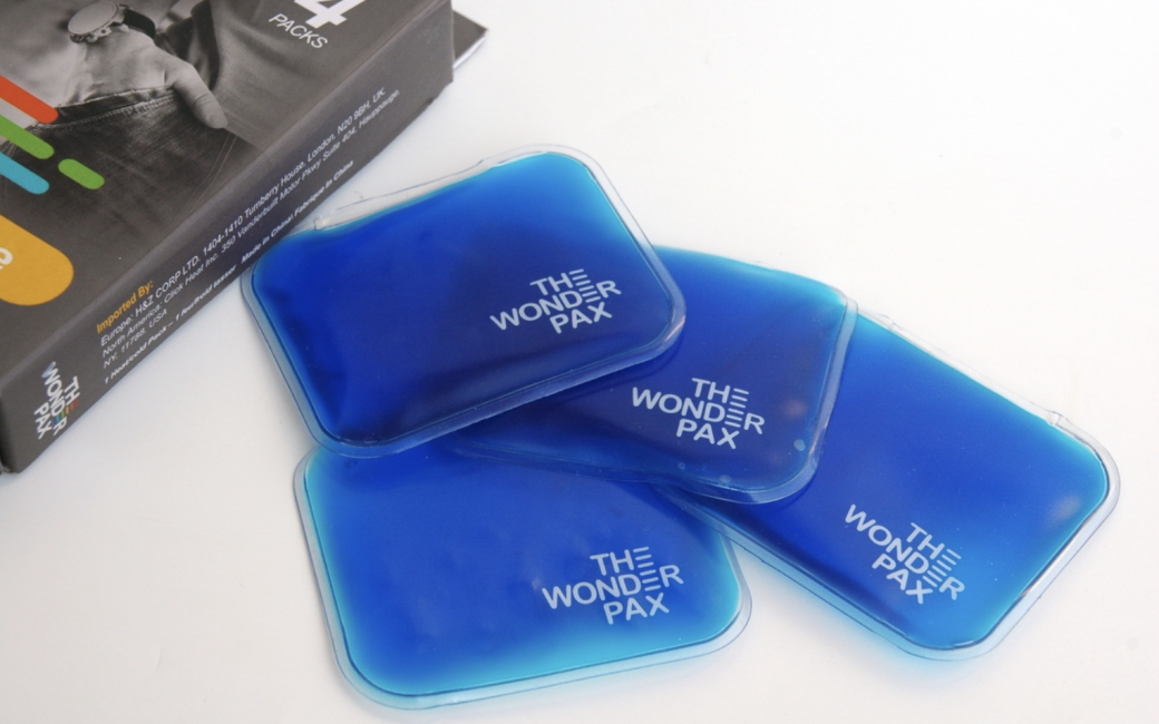 Four blue Wonderpax portable gel packs next to 4-pack packaging.