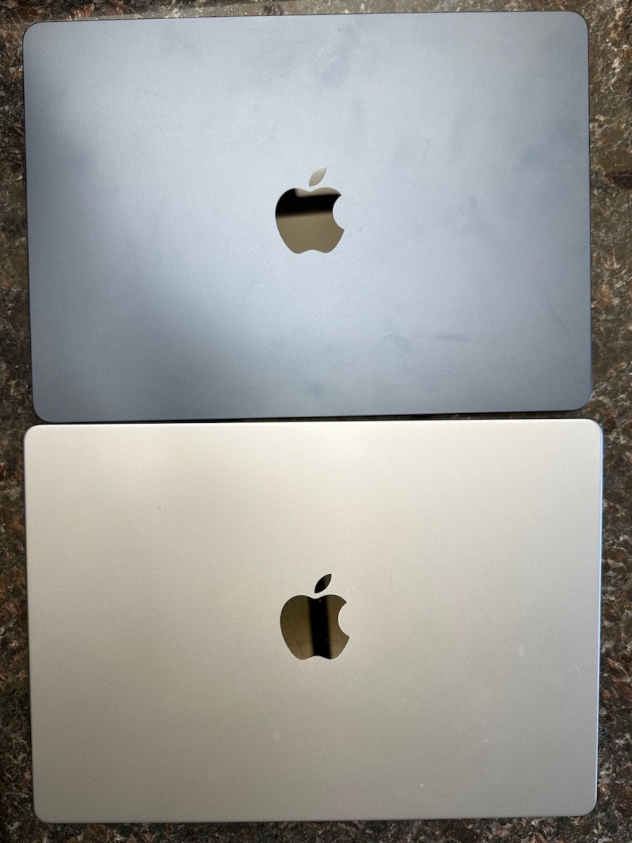 14 14 MacBook Pro Space Grey vs 13 Midnight M2 MacBook Air Covered in Fingerprints