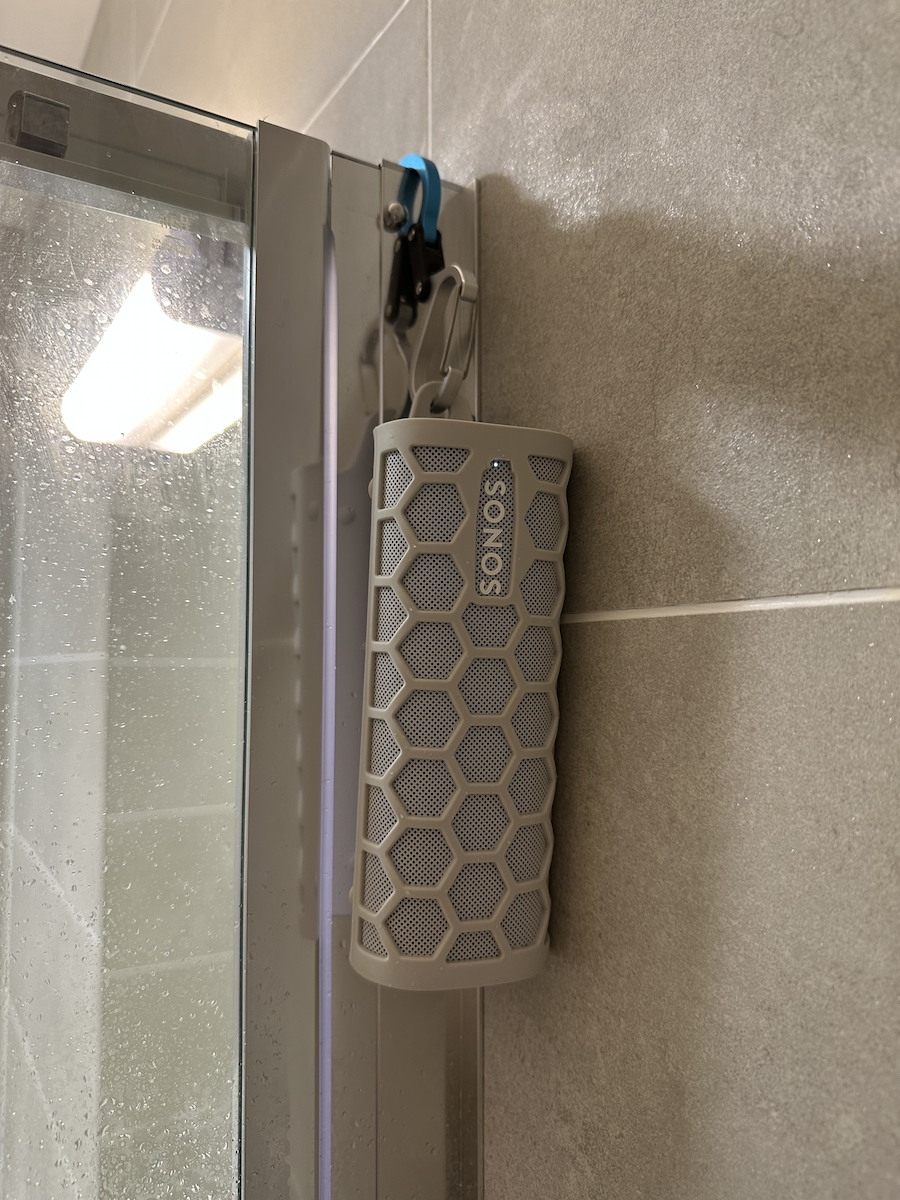 Sonos Roam hanging on a shower using the Hero Clip Bart describes in the article