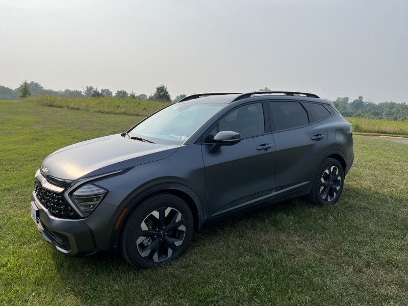 Kia Sportage in a Field Matte Grey.jpeg Kia Sportage in a Field Matte Grey