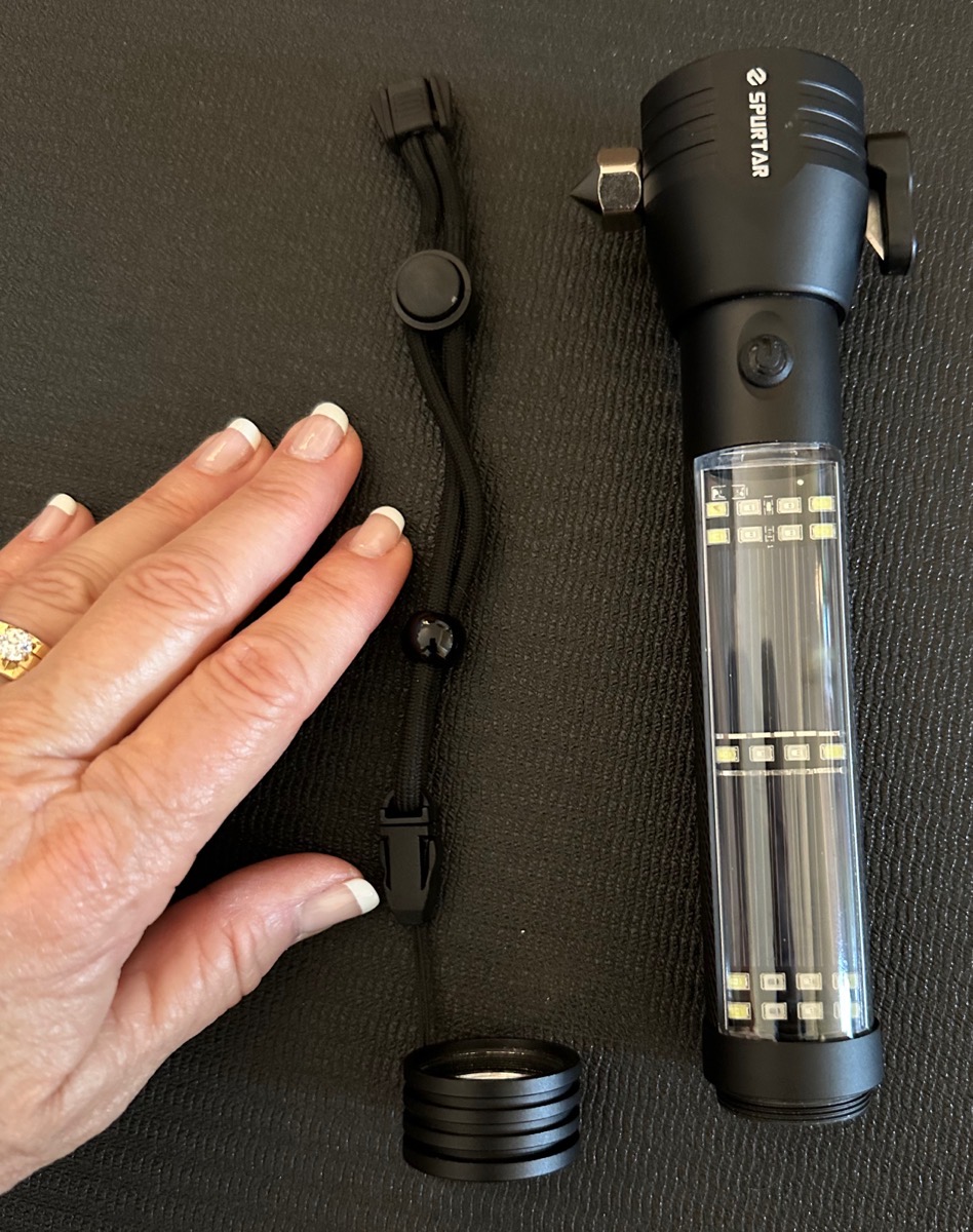 Spurtar Flashlight with Hand for scale
