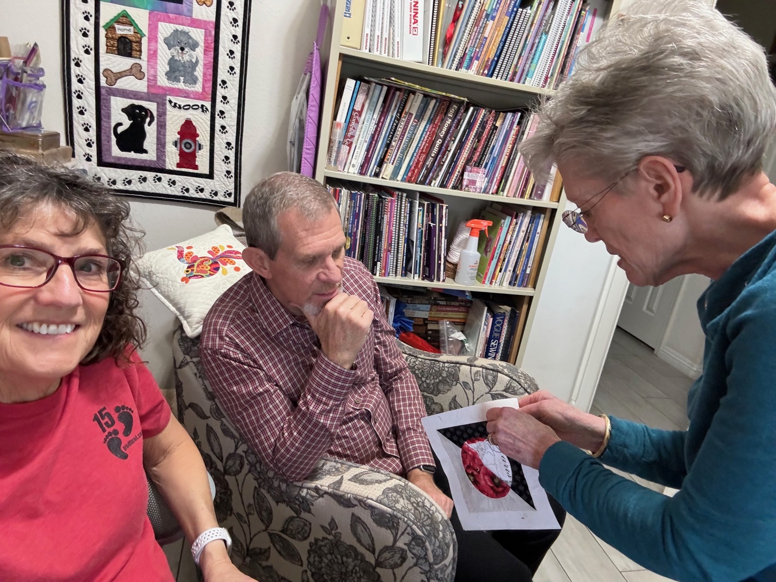 Sandy Teaching Quilting Techniques to Steve.