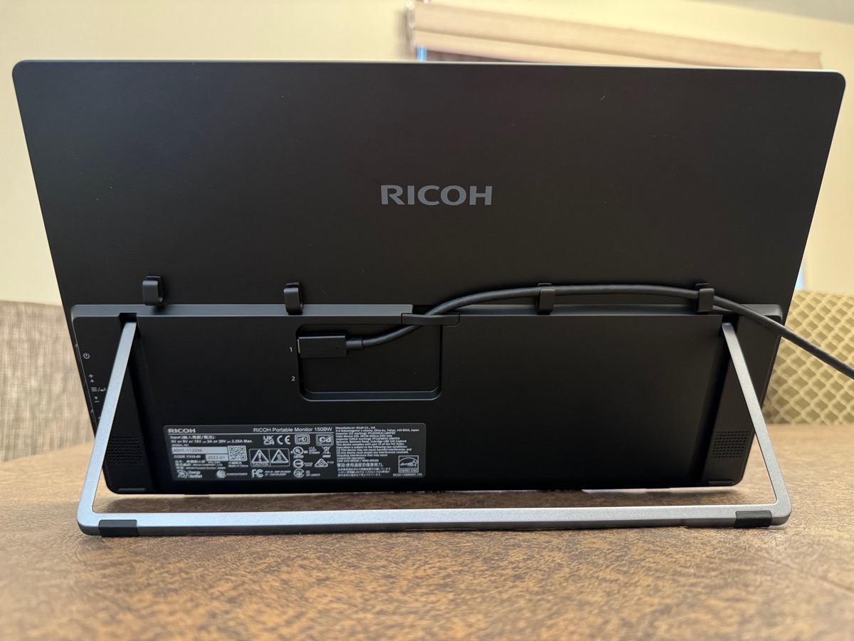 Back View of RICOH 150BW with kickstand out showing cable management.