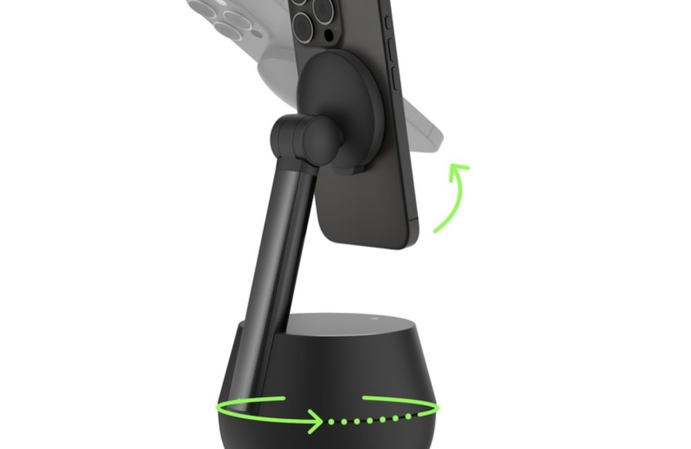 Belkin Auto-Tracking Stand pro with a circular disk base, small 3" stand, and a magnetic Qi2 charger with an iPhone attached to it. The picture shows with arrows how the base rotates and the Qi2 charger tilts up and down.