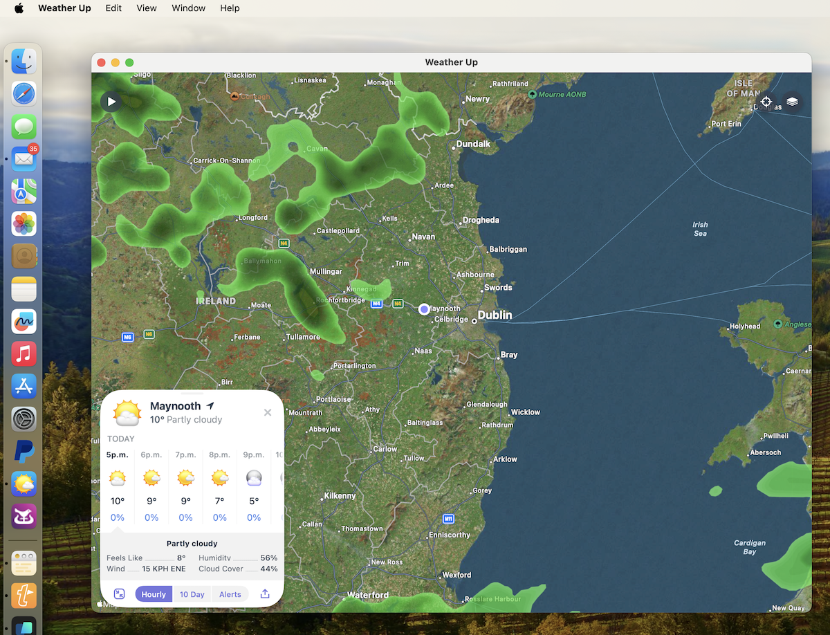 Window with a map with the current rainfall radar overlaid with weather details in a slide-up drawer on the bottom left. The slide-up drawer shows the current conditions, then a row cells with conditions for the next few hours, then detailed metrics including humidity and percentage cloud cover