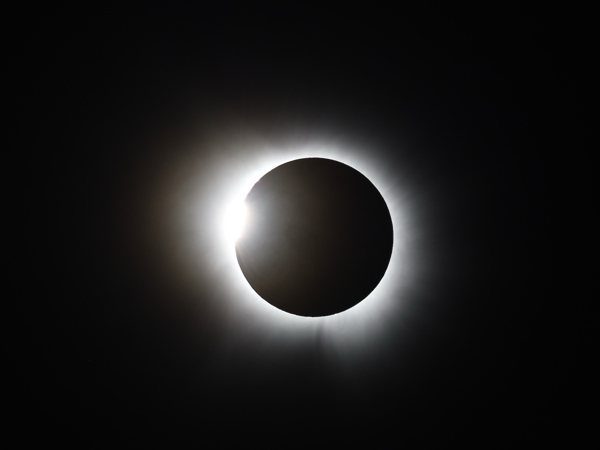 You can see the sun’s corona as dwarfs the Moon’s shadow. I was lucky enough to have my camera set to capture six flares and the diamond ring lying on its side. You can see the contrast of the dark black moon and the sunspots on the boiling sun.