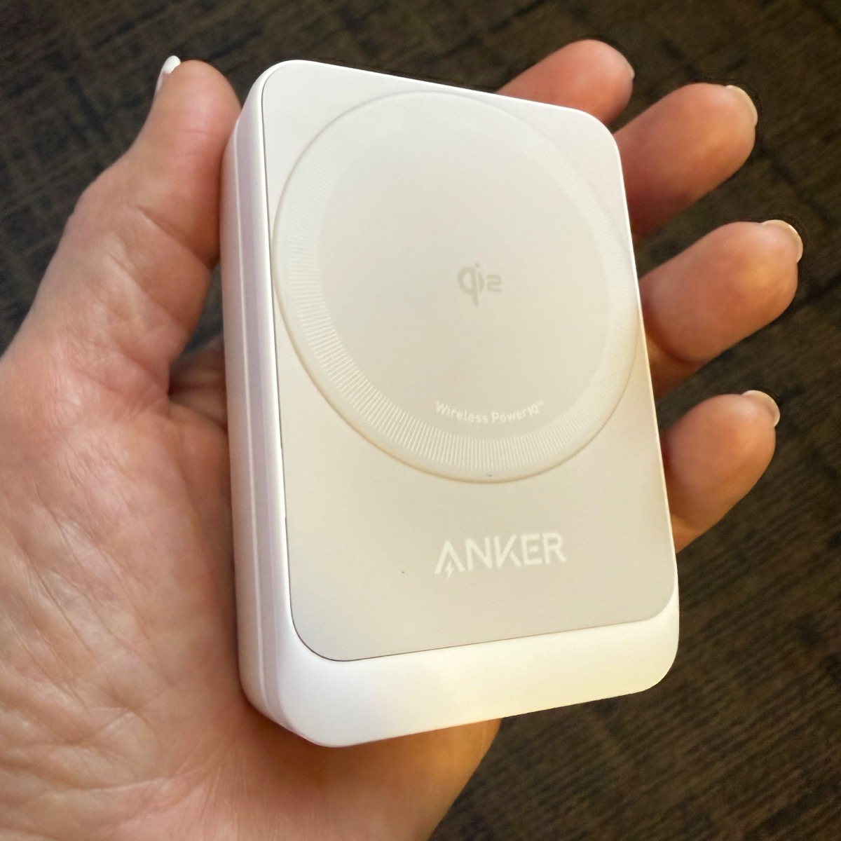 Anker MagGo Charger in the palm of my hand.
