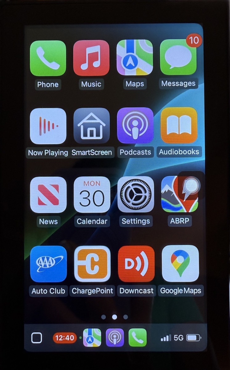 CarPlay Screen in Portrait Mode showing all of my apps with a dock below.