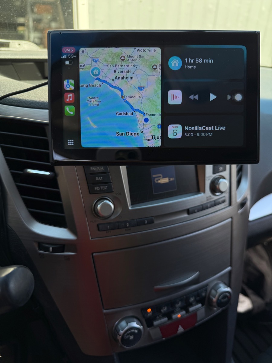 CarPlay screen mounted on Subaru. Showing navigation what is playing and my next calendar appointment as NosillaCast Live at 5 PM