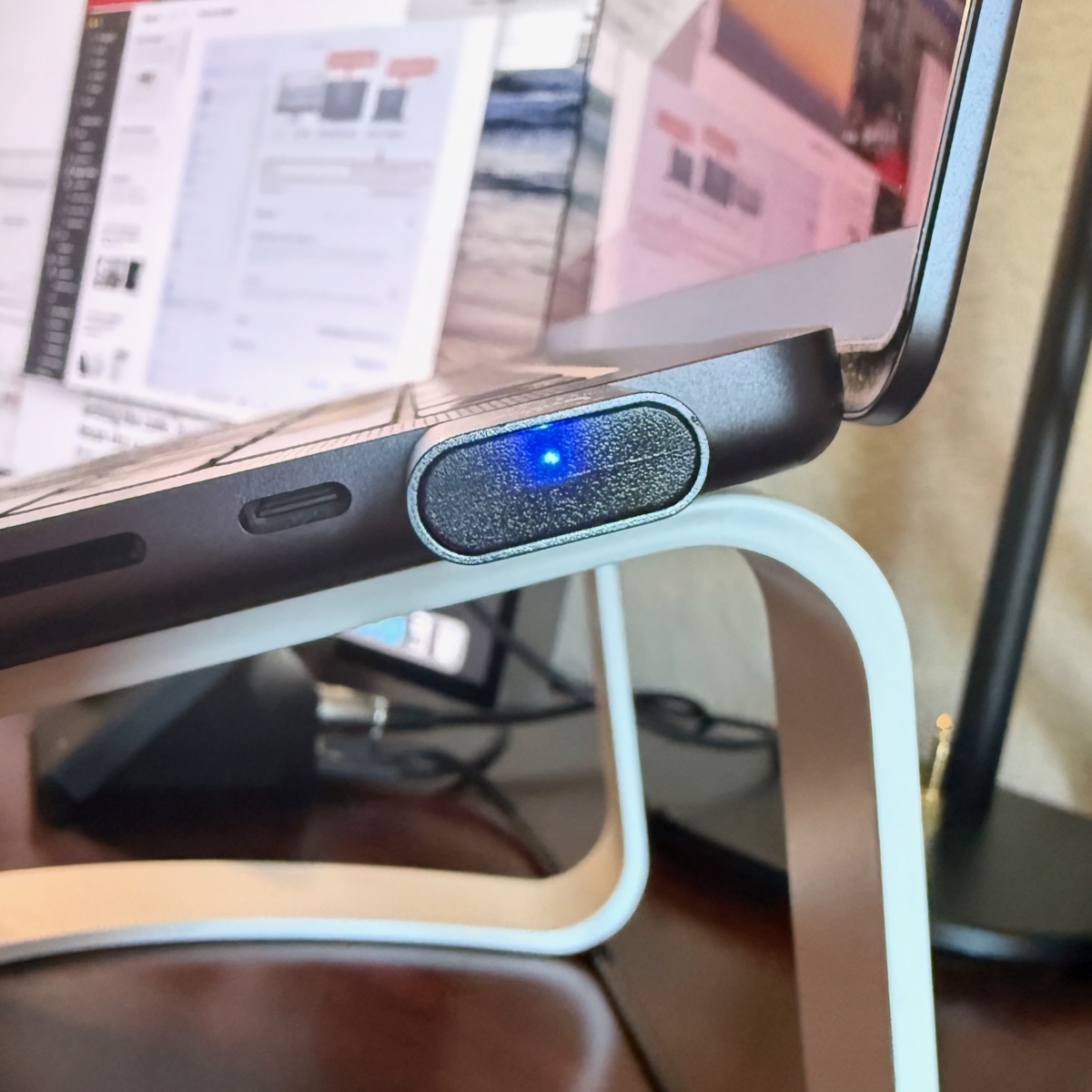 EDID HDMI dongle end on plugged into a MacBook Pro with a blue light on.jpeg EDID HDMI dongle end on plugged into a MacBook Pro with a blue light on.