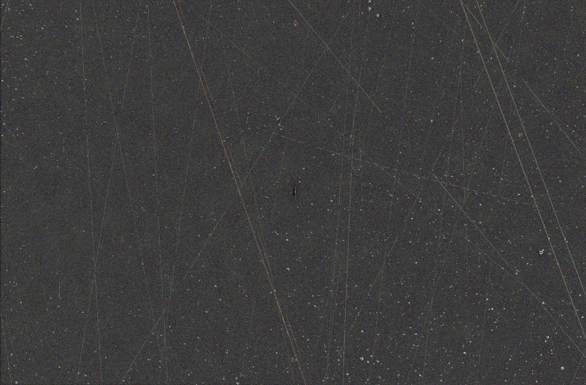 In this picture, you can see over forty satellite trails and at least two aircraft.  Additionally, some high clouds could have rolled through causing dimming of certain parts of a picture, these can also be seen as part of the haze in the picture.  Finally, some hallucinations by the sensor would also be removed in this part of the process.