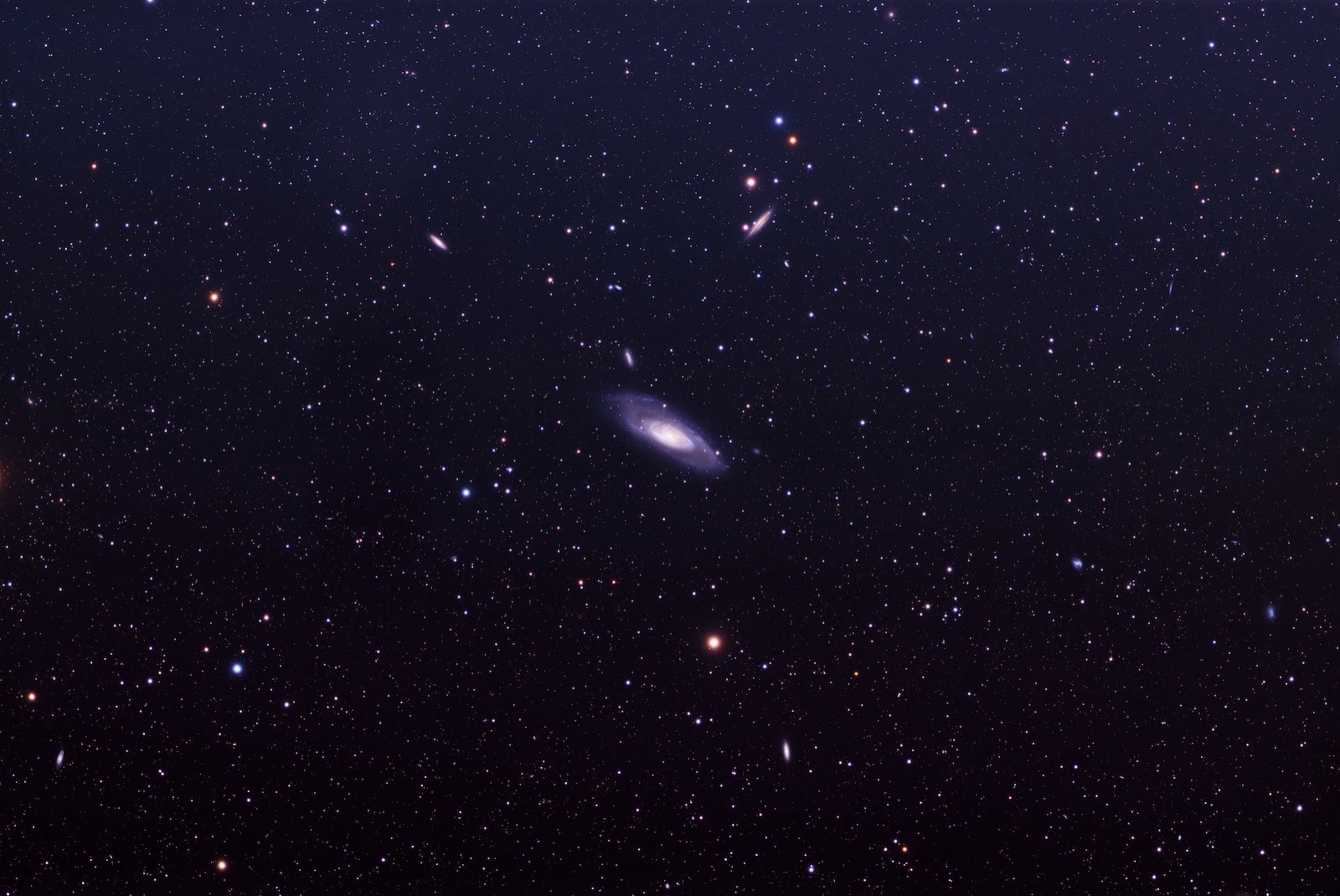 In the center of this picture is galaxy M106.  It is a spiral galaxy and its major arms and dust clouds are visible due to the number of frames I was able to capture this year.  The center of this galaxy is less defined partly because of the distance and relative size my camera sees.  Surrounding M106 is a host of other galaxies.  Looking into every corner of this picture, I can count galaxies. 