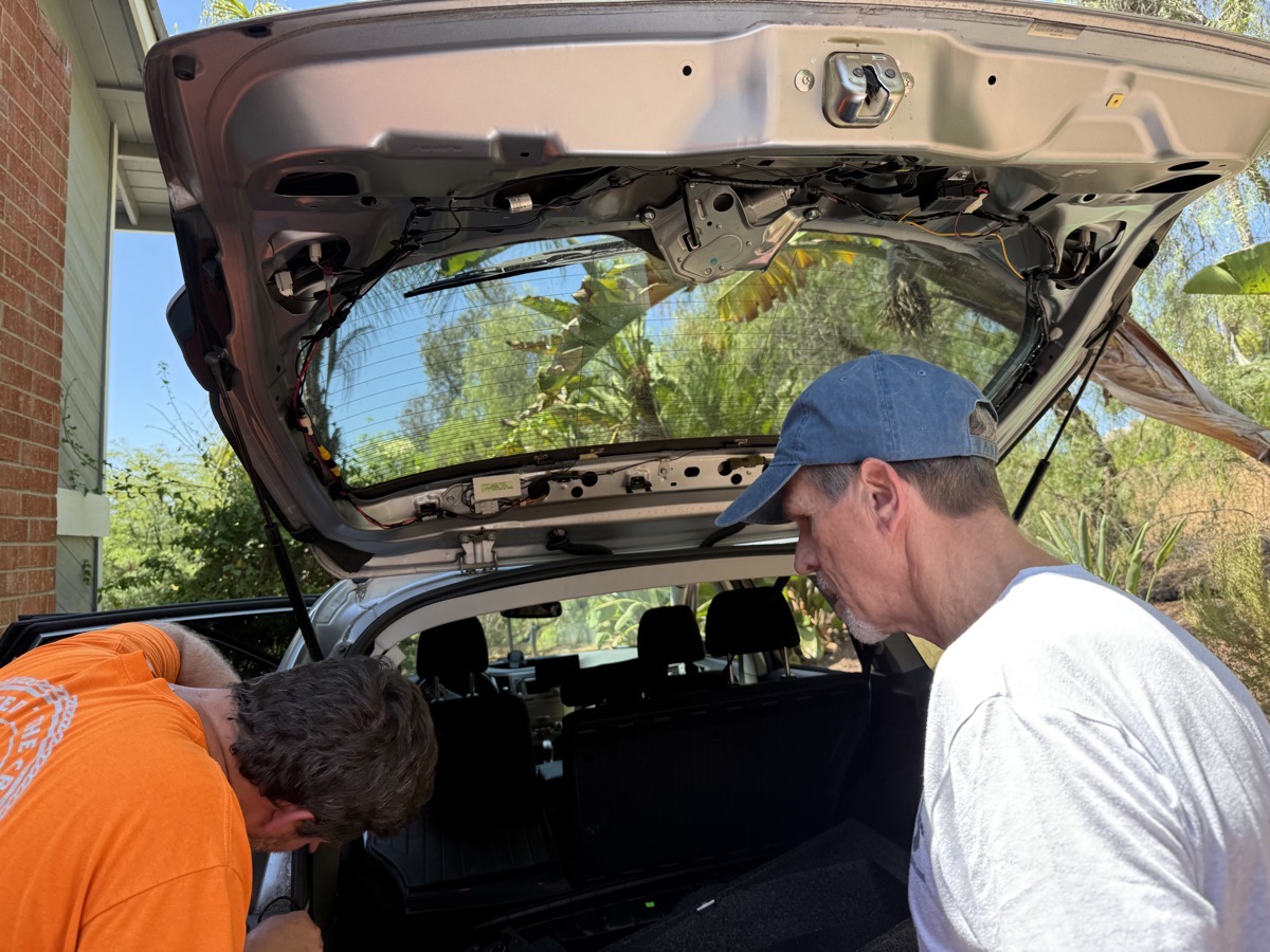 Nolan Steve running wires into hatch.jpeg Nolan Steve running wires into hatch.