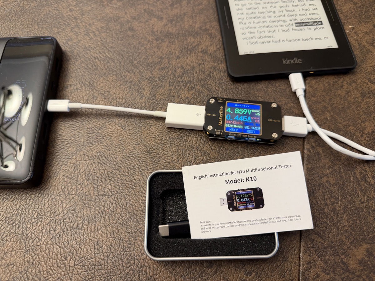 Battery plugged into Multimeter plugged into Kindle.