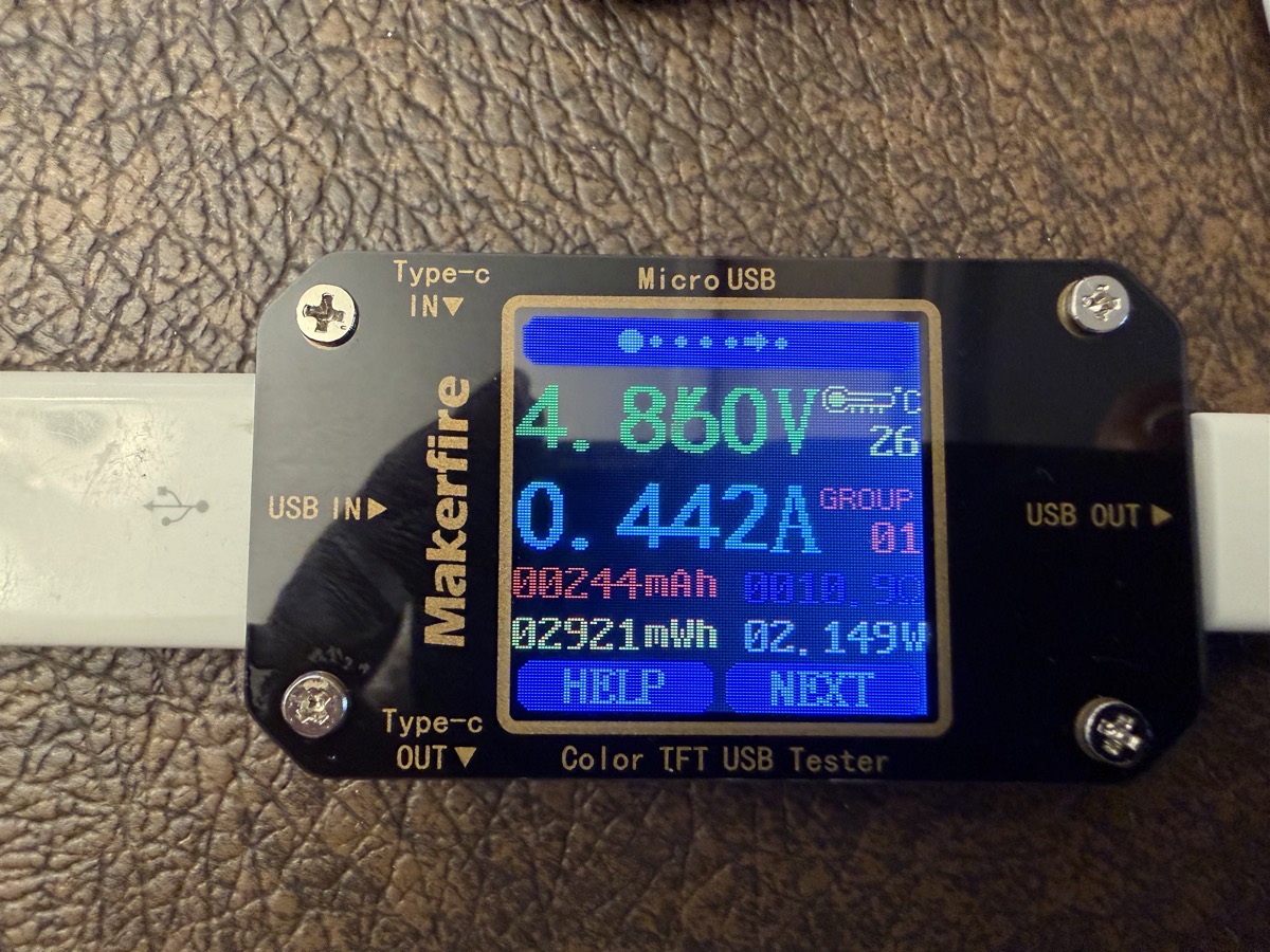 Makerfire multimeter showing V A mAh mWh and help next buttons.
