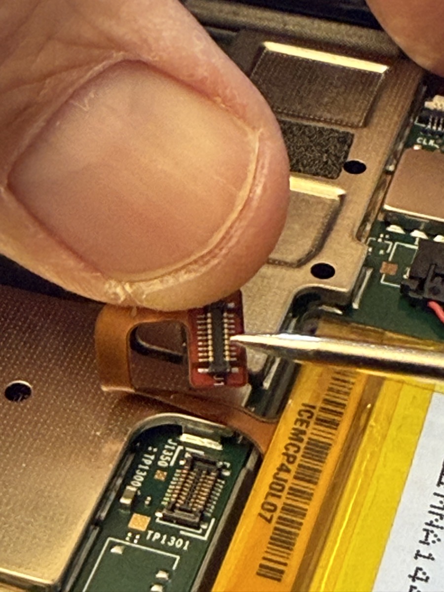 Multimeter Probe size compared to the pins on the battery connector.