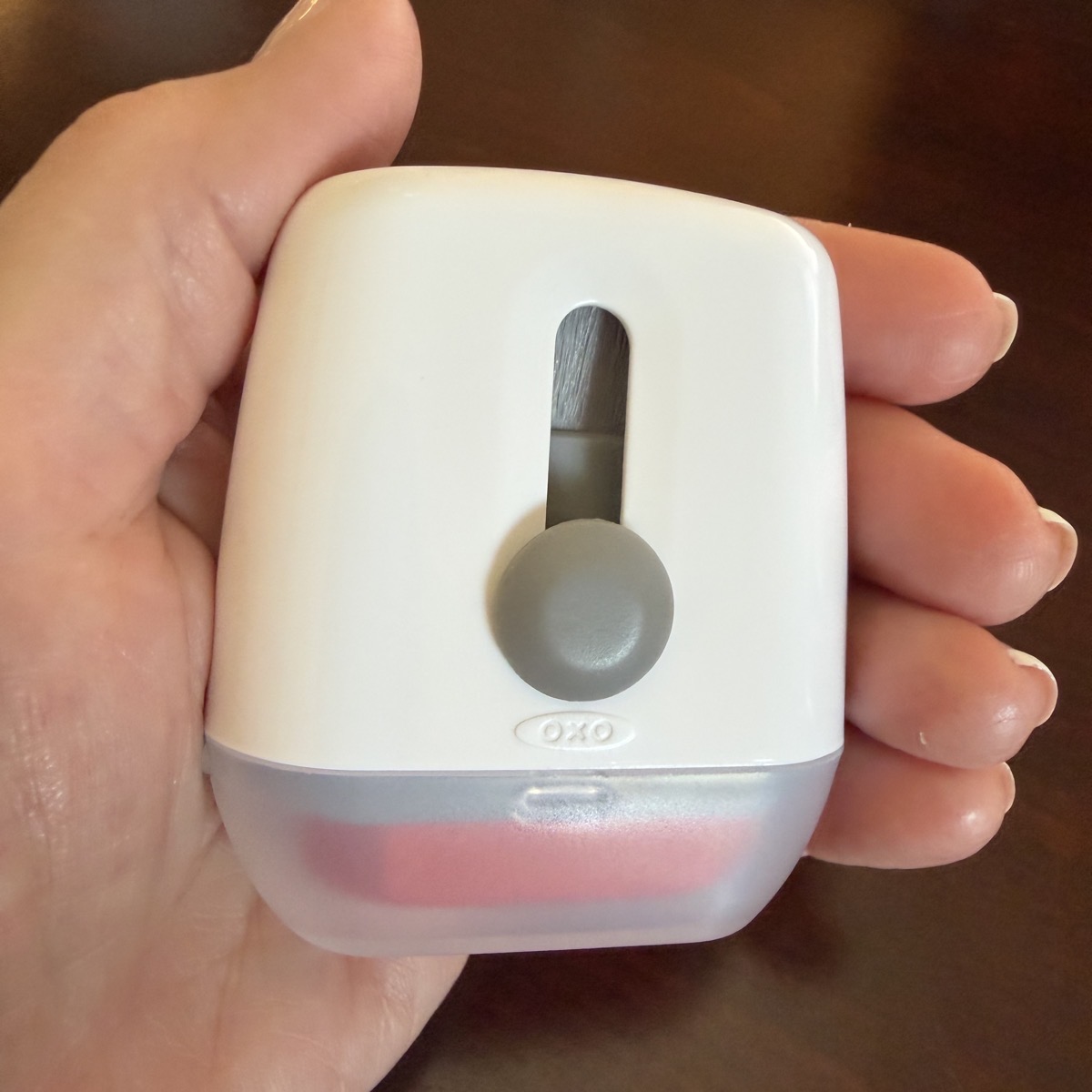 oxo sweep and swipe in the palm of a hand with the brush and cloth swiper hidden.jpeg Oxo sweep and swipe in the palm of a hand with the brush and cloth swiper hidden.