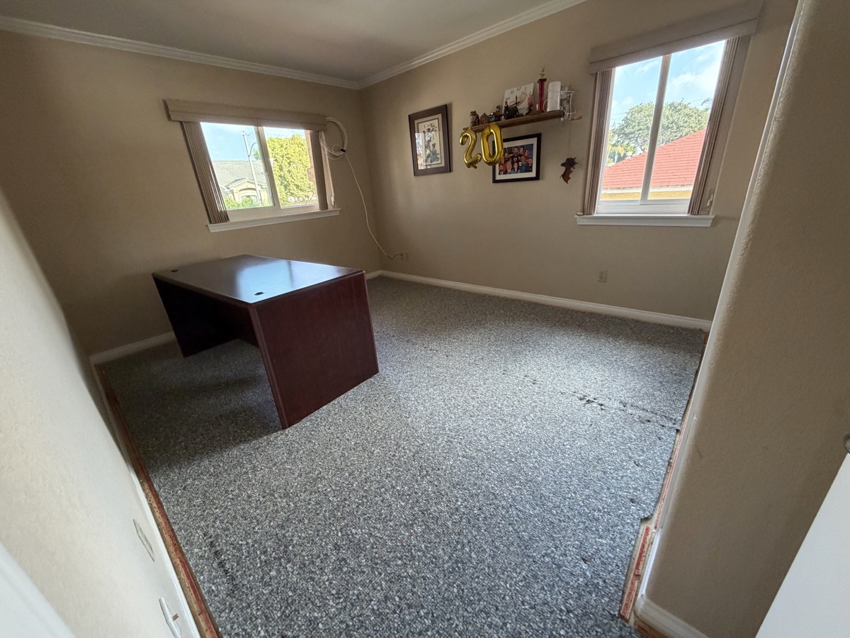 My studio empty except for desk they couldn't easily move. My shelf with the 20-year balloons is still up so you can tell it is my studio.