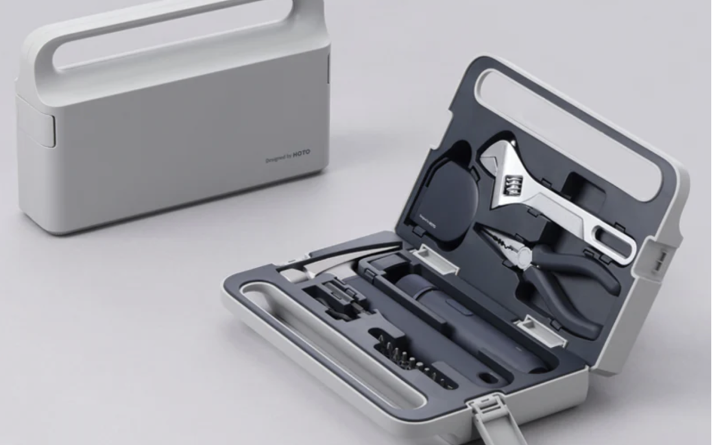 Compact Hoto Electric Screwdriver Kit Pro Tool Set with a built-in handle, shown both closed and open, revealing neatly organized hand tools including pliers, a wrench, screwdriver bits, and a cylindrical electric screwdriver, all inside a case with molded cutouts for each tool.