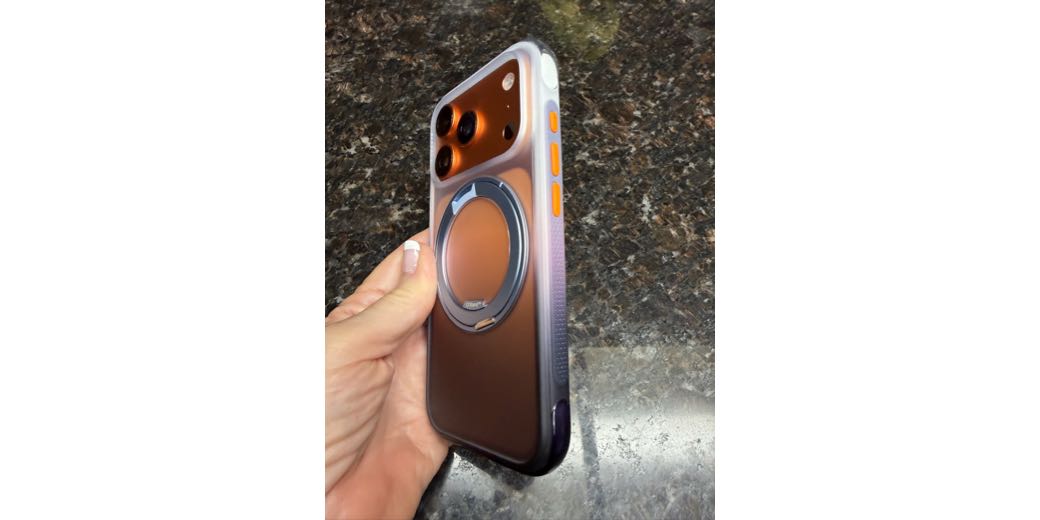 Cosmic Orange iPhone wearing the dusk haze purple O3 Air case and cosmic orange buttons