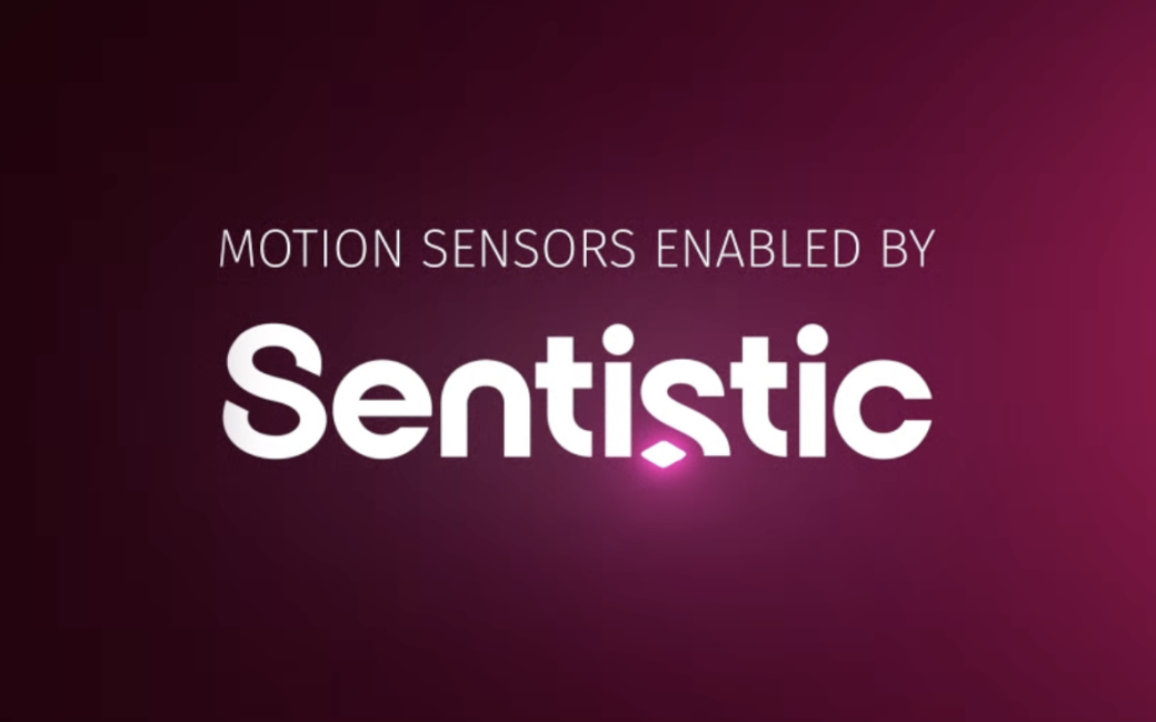Text graphic with a dark magenta gradient background and the words “MOTION SENSORS ENABLED BY” in small uppercase letters above the large white logo text “Sentistic,” which has a small glowing pink diamond shape under the letter “s.”