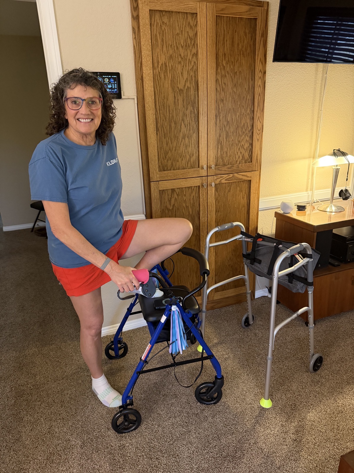 Fancy New rollator with geriatric walker in background.