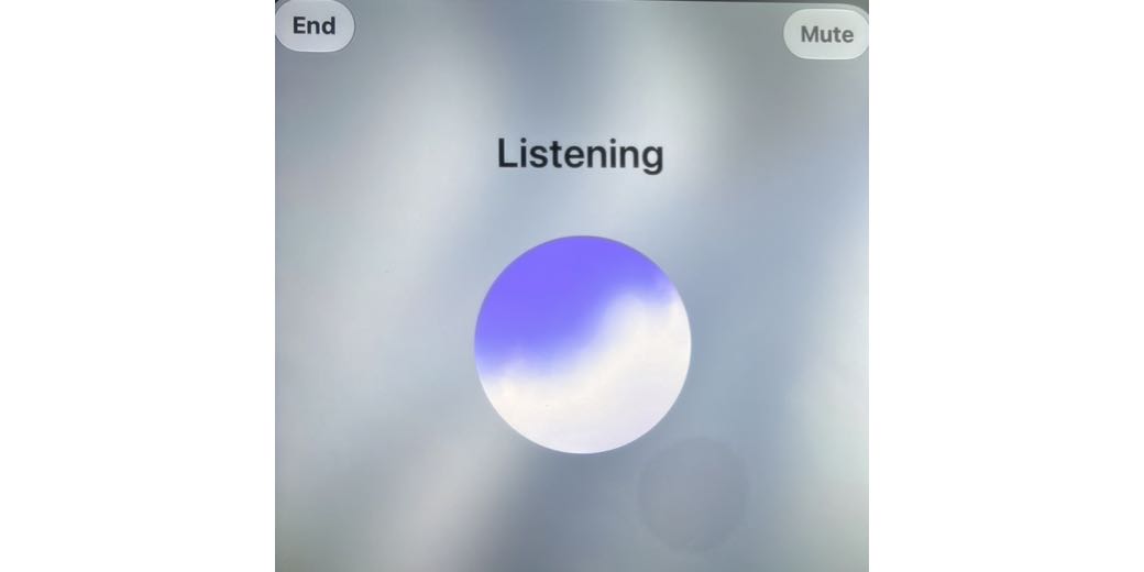 a purple and white glowing orb with the word Listening above it