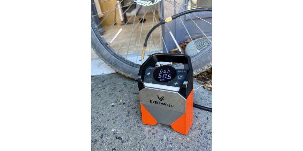 Compressor sitting on the ground with a handle and a giant display. the rest of that interface is explained in the post