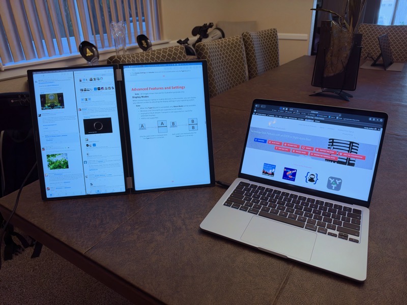 ViewSonic VG1457 dual displays standing vertically on a table connected to a MacBook Air