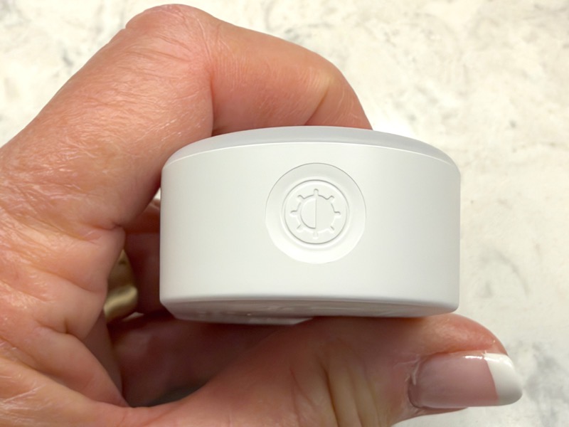 Lyridz showing closeup of button to change brightness.jpeg Lyridz showing closeup of button to change brightness.
